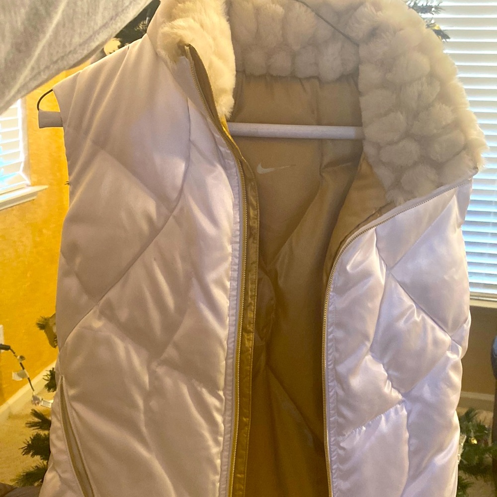 Reversible Nike gold and white puffer vest.